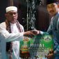 Wakil Bupati Tanah Bumbu, H Muhmmad Rusli Saat Serahkan Hadiah Kepada Juara I di MTQN XIX Tingkat Kabupaten di Kecamatan Karang Buntang